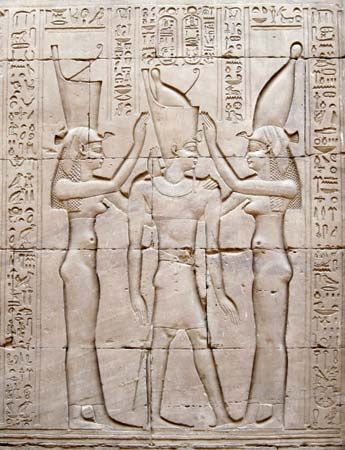 Ptolemy VIII Euergetes II (died 116 BC) between the goddess Wadjet and goddess Nekhbet, relief on wall of Temple of Idfu, Egypt. Also called Edfu, Egypt. Physcon (potbellied in Greek). Macedonian King of Egypt.